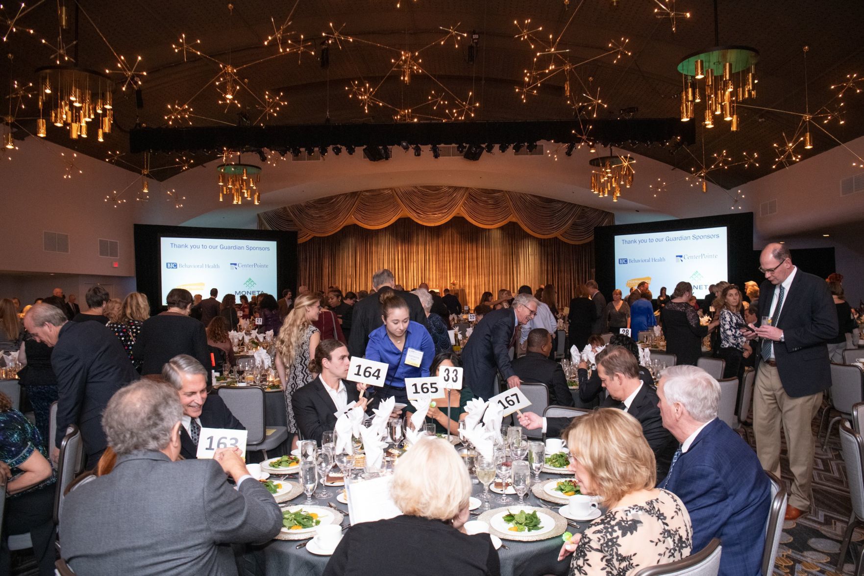 Guests take their seats for the gala's dinner.